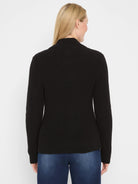 Black shaker knit jacket with ribbed texture and mock neck, worn by a woman from behind.