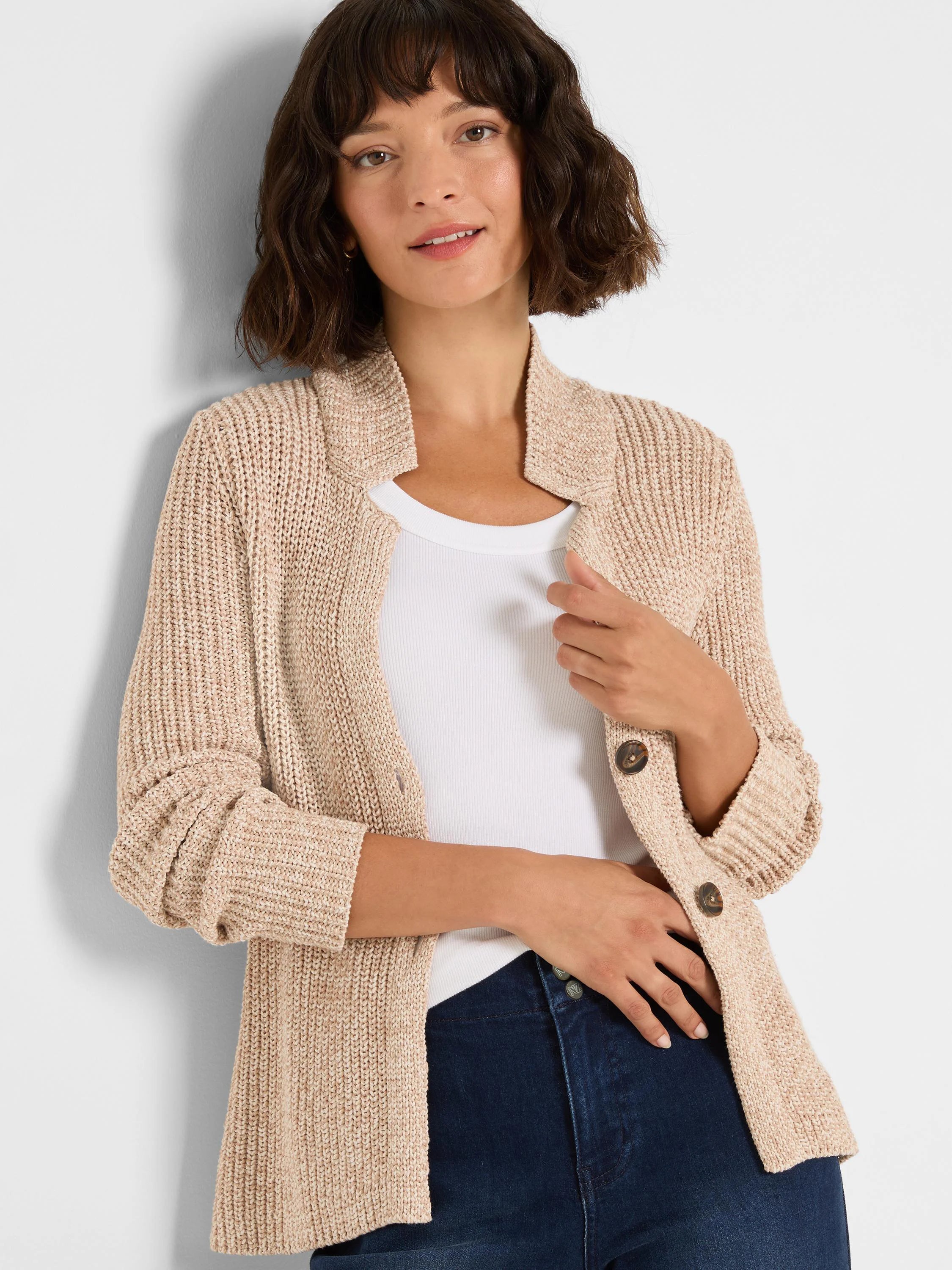 Oatmeal shaker knit cardy jacket with a shawl collar and dark round buttons.