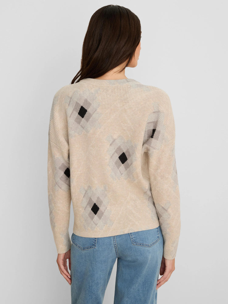 Beige shaker stitch sweater with black and faded grey diamond print.
