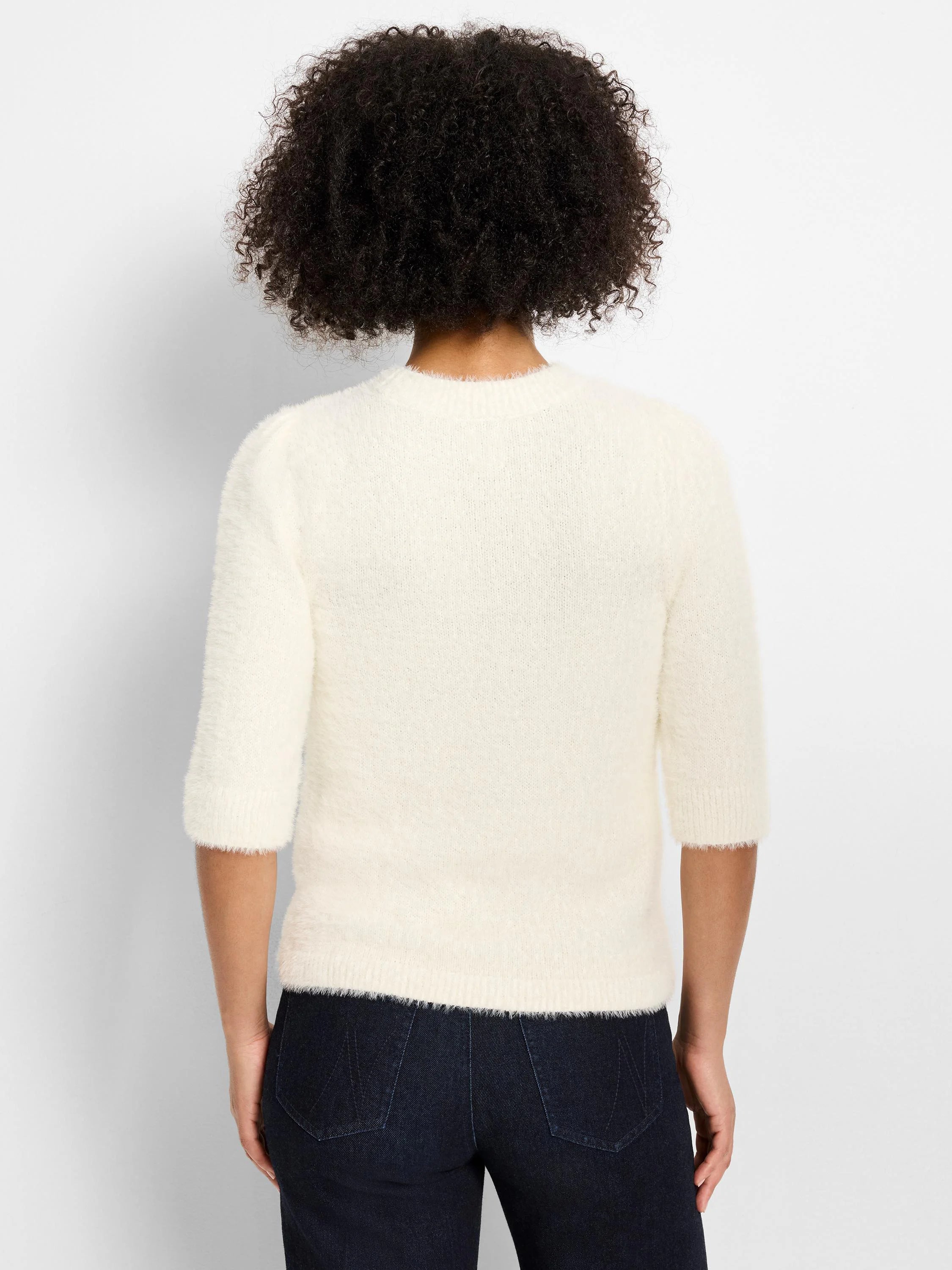 Off-white, fuzzy sweater with 3/4 sleeves, subtle puff shoulders, and a crew neck, shown from the back.
