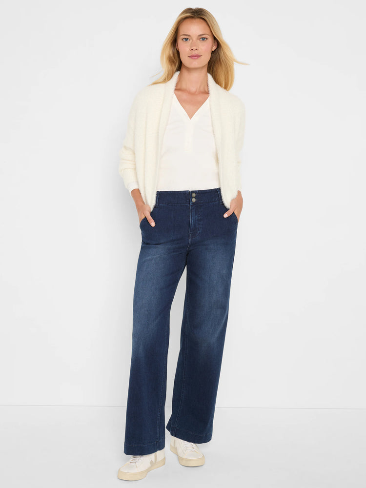 Off-white fuzzy knit shrug cardigan with an open front and wide, soft collar.
