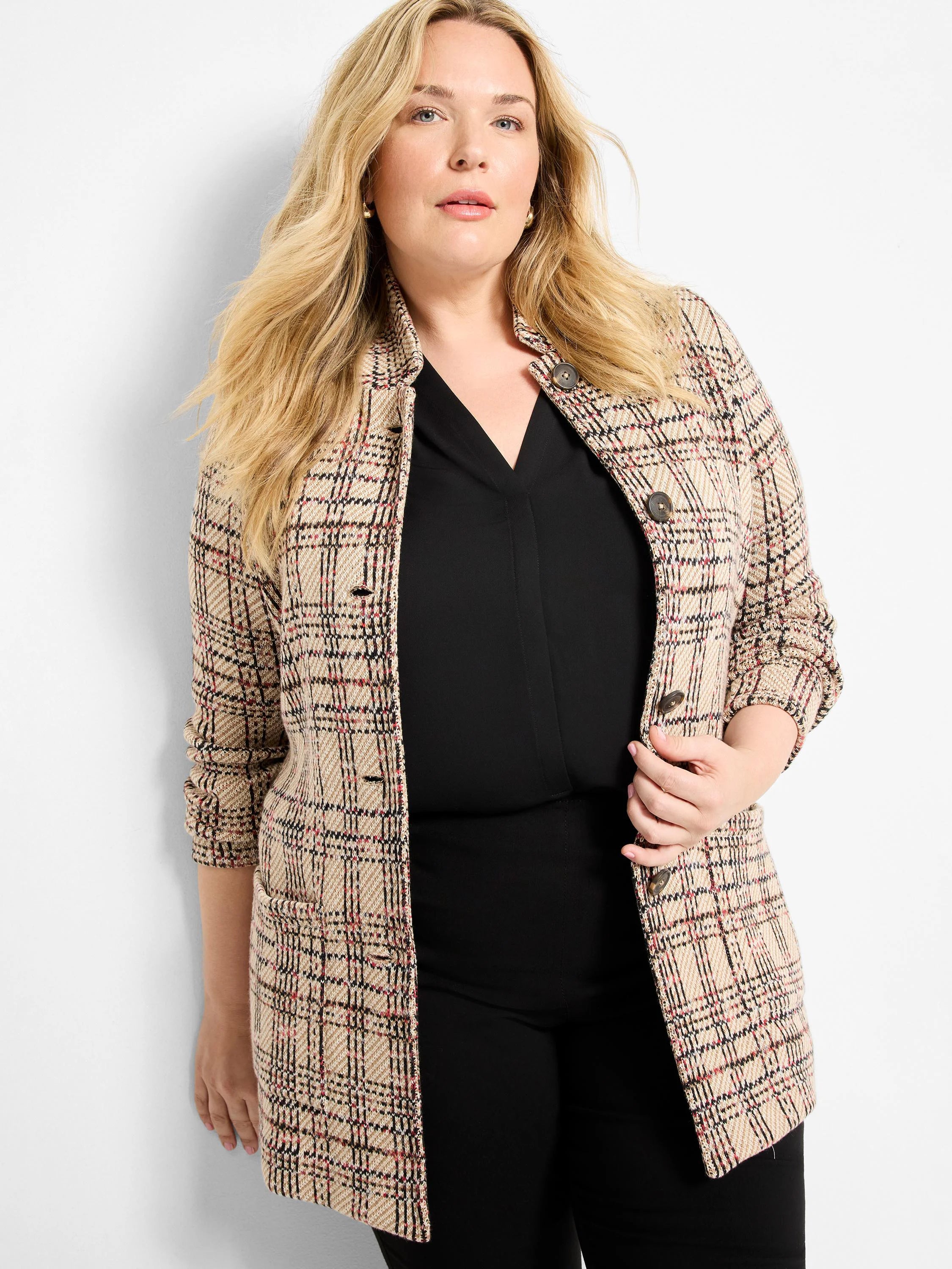 Beige knit blazer with a black and red plaid pattern, featuring a standing collar and dark buttons.