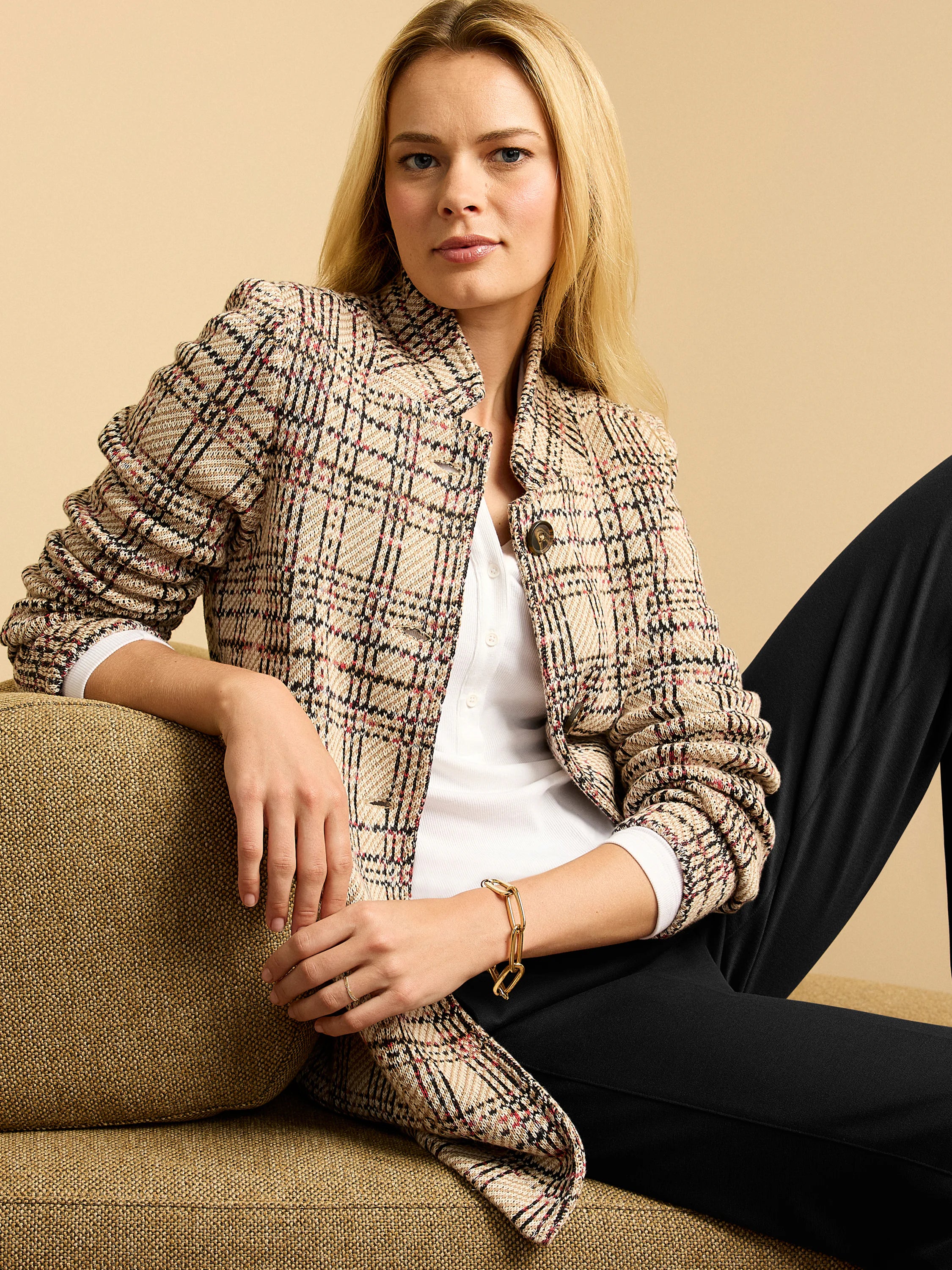 Beige knit plaid blazer with black and red lines, band collar, and gathered sleeves.