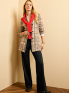 Long beige knit blazer with black/red plaid & pronounced stitch texture, featuring dark brown buttons.
