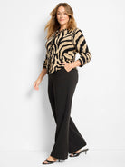 Black and tan zebra jacquard cardigan with gold buttons and 3/4 sleeves.