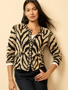 Black and tan animal print jacquard cardigan with a crew neck and pearl buttons.