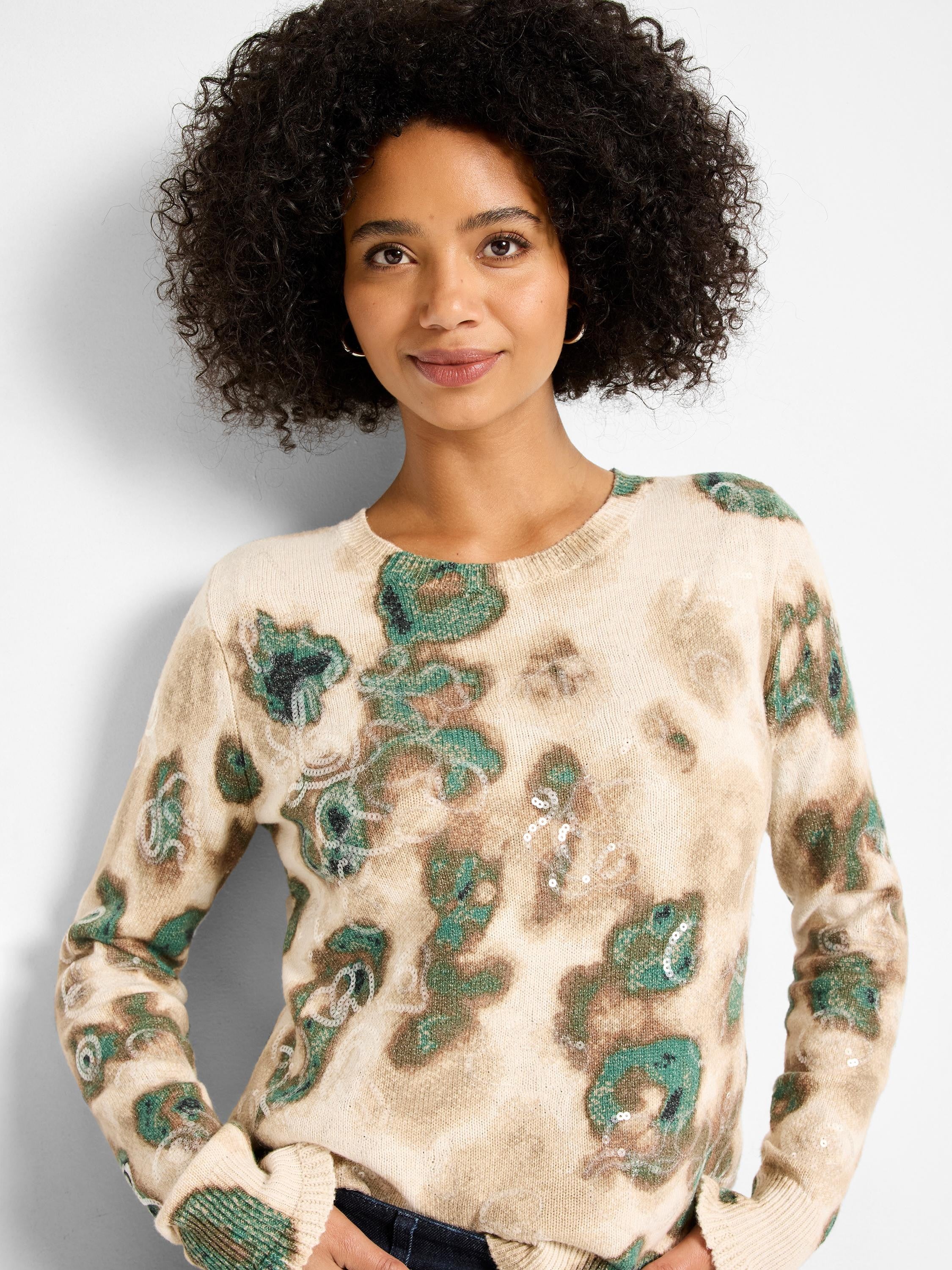 Beige sweater with abstract teal and brown camouflage pattern, featuring scattered clear sequins.