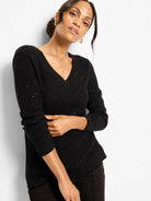 Black waffle V-neck sweater featuring scattered silver shimmer.