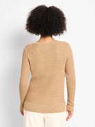 Back of a tan waffle knit sweater. The textured fabric has scattered tiny reflective flecks for shimmer.
