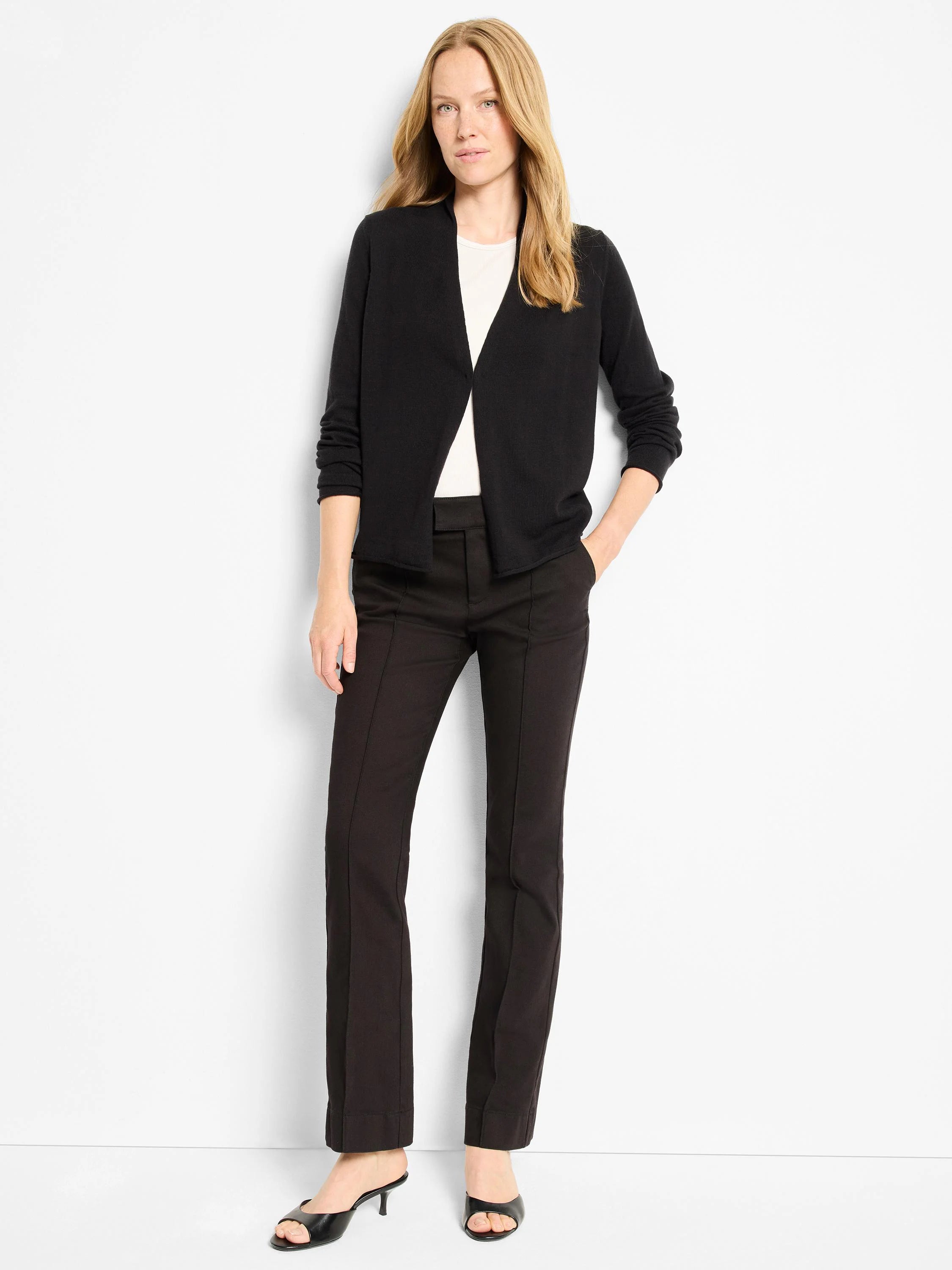 Black open-front cardigan with a V-neck, long sleeves, ribbed cuffs, and ribbed hem.