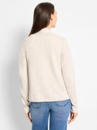 Light beige knit cardigan, stand collar, long sleeves, hip-length, shown from back.
