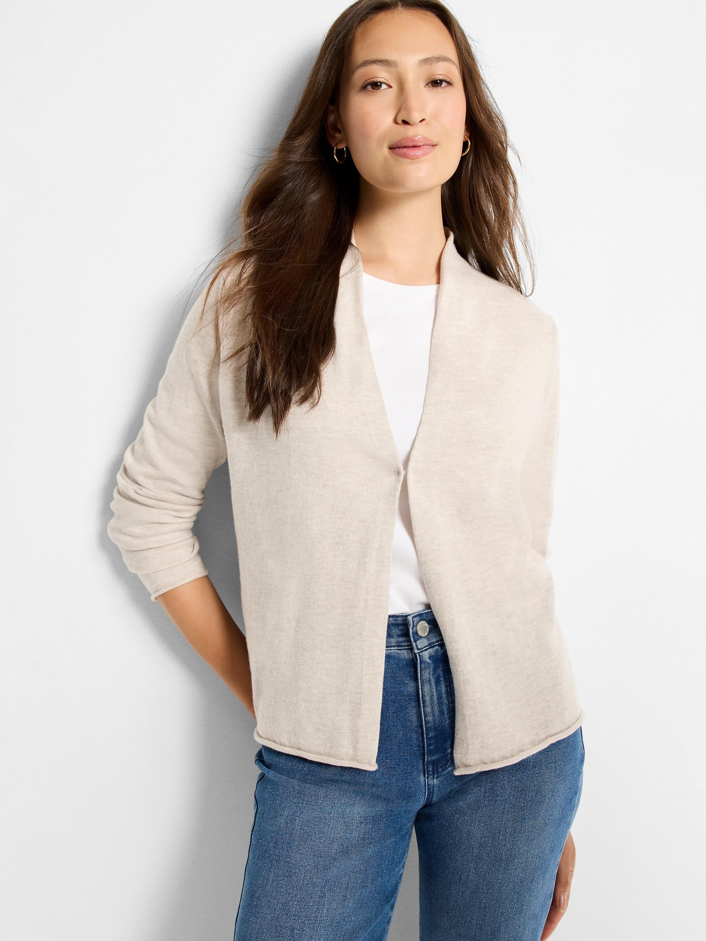 Light oatmeal open-front cardigan with a soft shawl collar and long sleeves with ribbed cuffs.