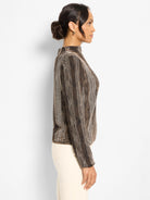 Ombre mock-neck sweater with pixel knit pattern in shades from light tan to dark brown.