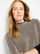 Funnel neck pixel knit sweater. Black with off-white textured dots across the body, solid black collar and cuffs.