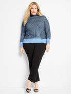 Blue funnel neck sweater with dark blue pixel knit body & light blue ribbed cuffs & hem.
