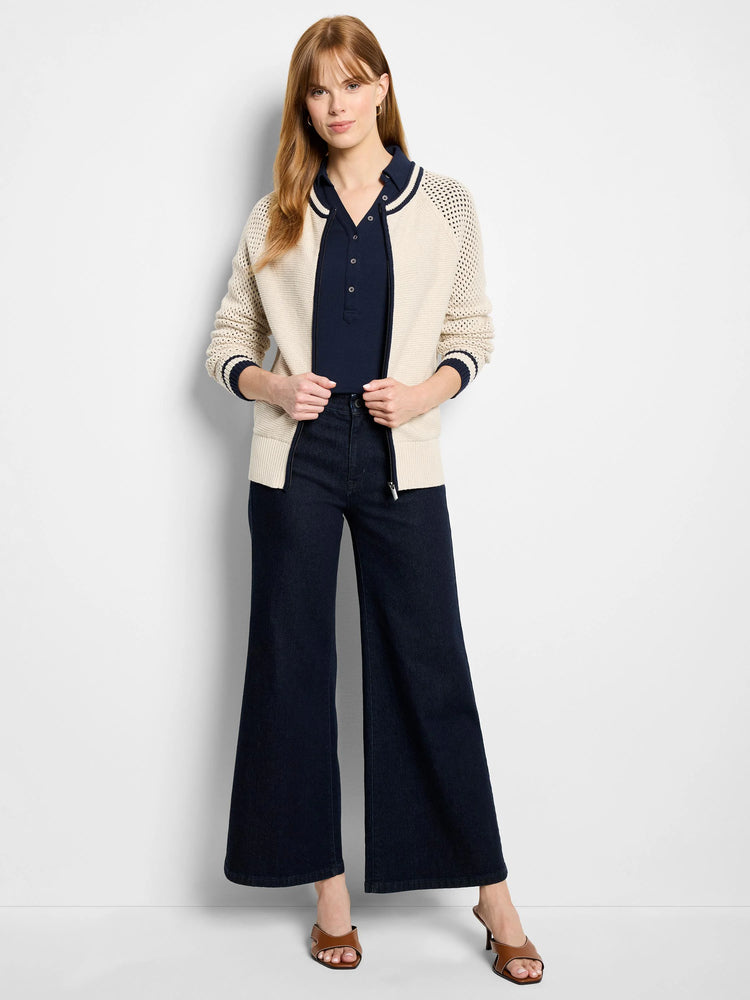 Off-white cotton mesh cardigan with navy blue trim and zipper.  Mesh panels at shoulders.
