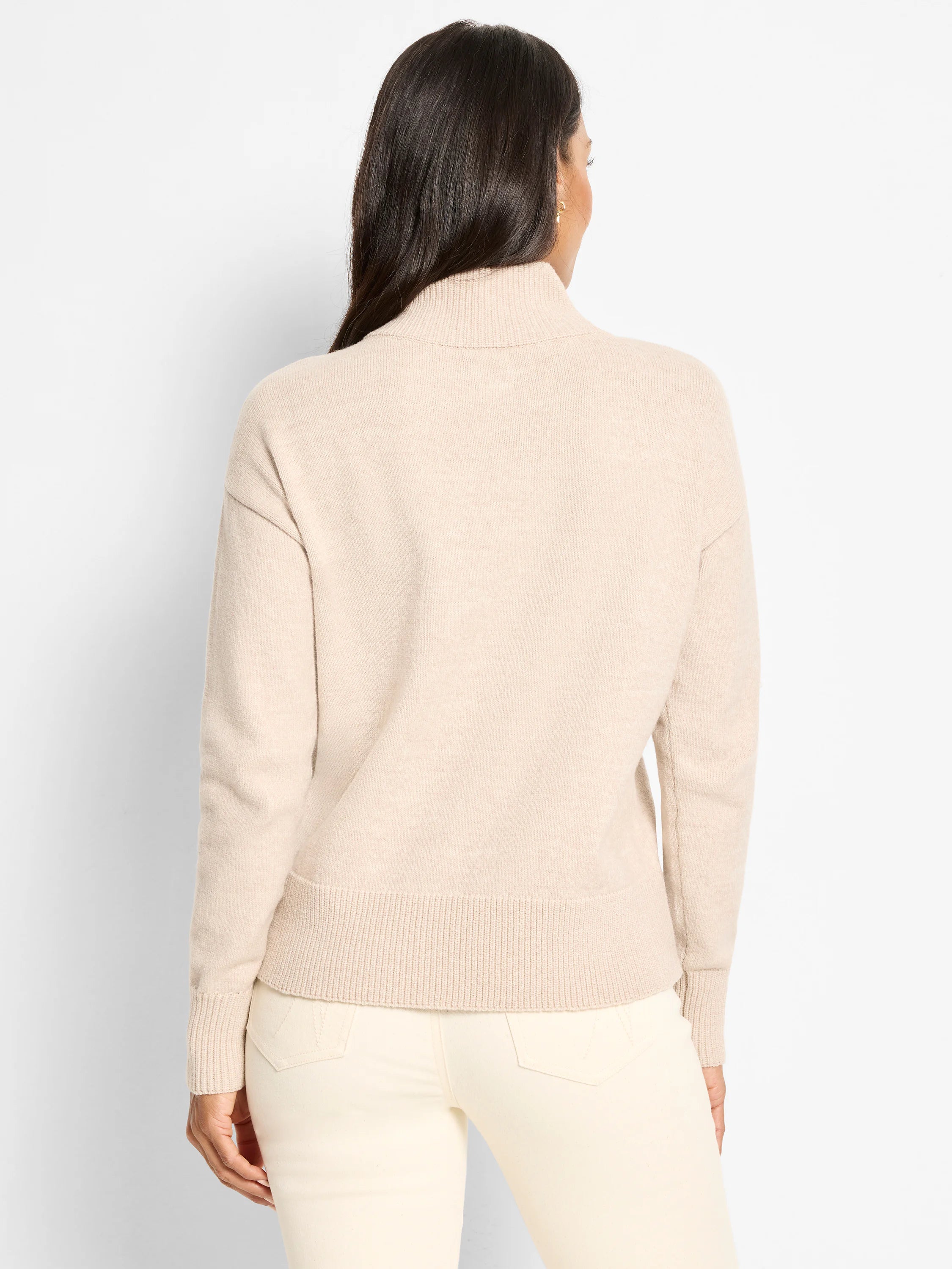 Light beige mock neck sweater with long sleeves, ribbed cuffs and hem, shown from the back.