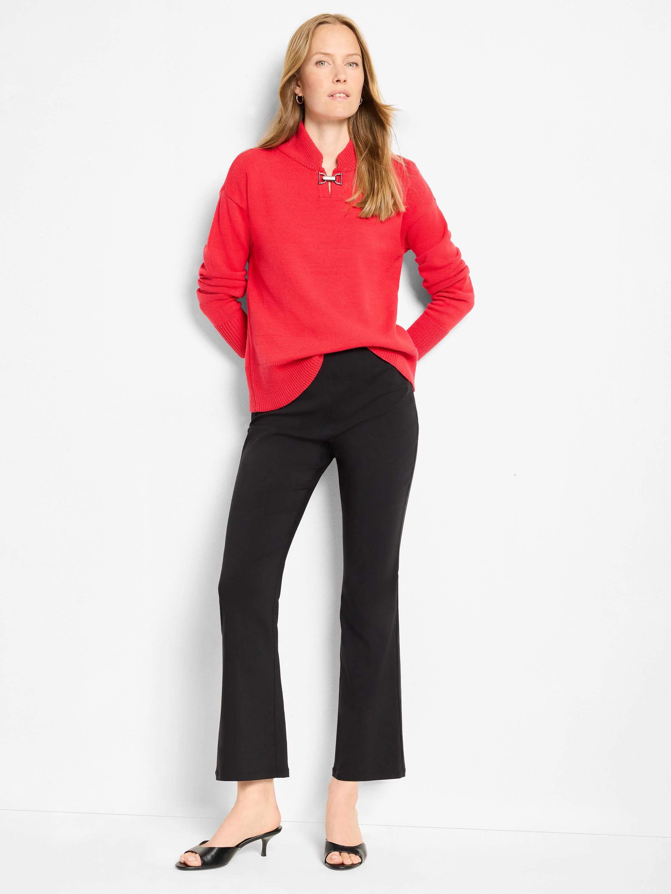 Red long-sleeve sweater with a mock neck and decorative silver-tone buckle clasp.
