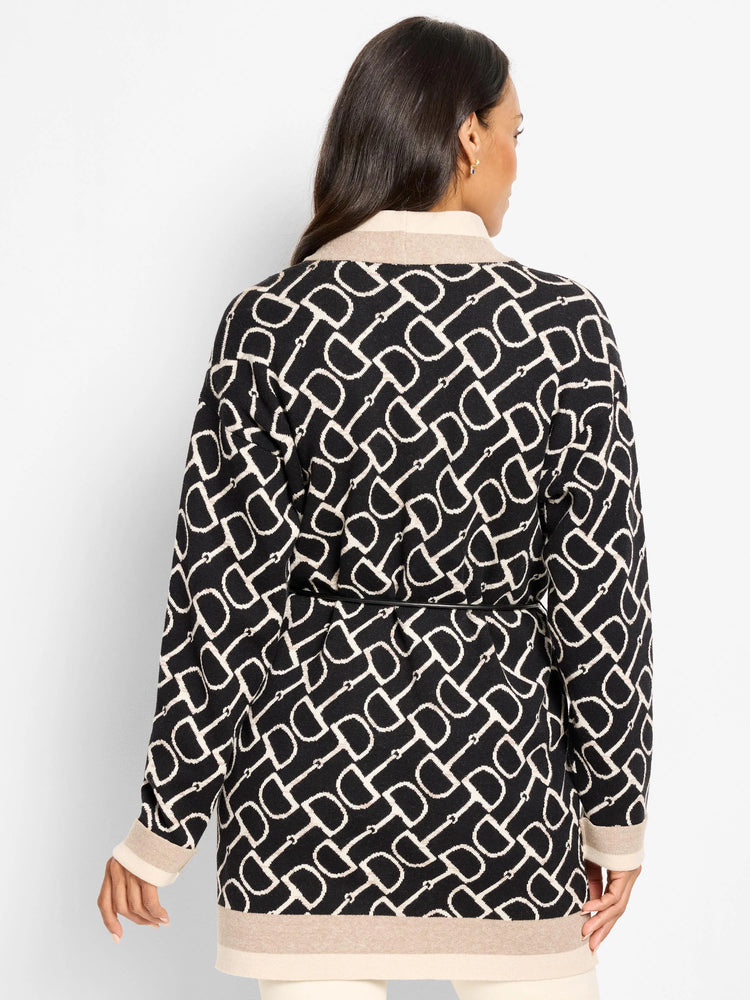 Black & cream horse bit pattern jacket with thin black belt, beige collar, cuff, & hem trim.