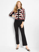 Black, cream, and red geometric pattern button-front cardigan with a crew neck and ribbed trim.