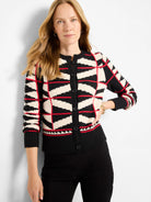 Black, cream, and red geometric cardigan with angular patterns, button front, crew neck, and ribbed hems.