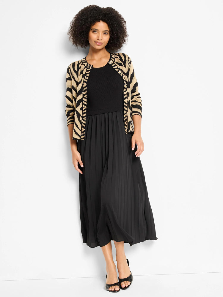 Black pleated midi dress with ribbed top, worn with a tan and black zebra print cardigan.