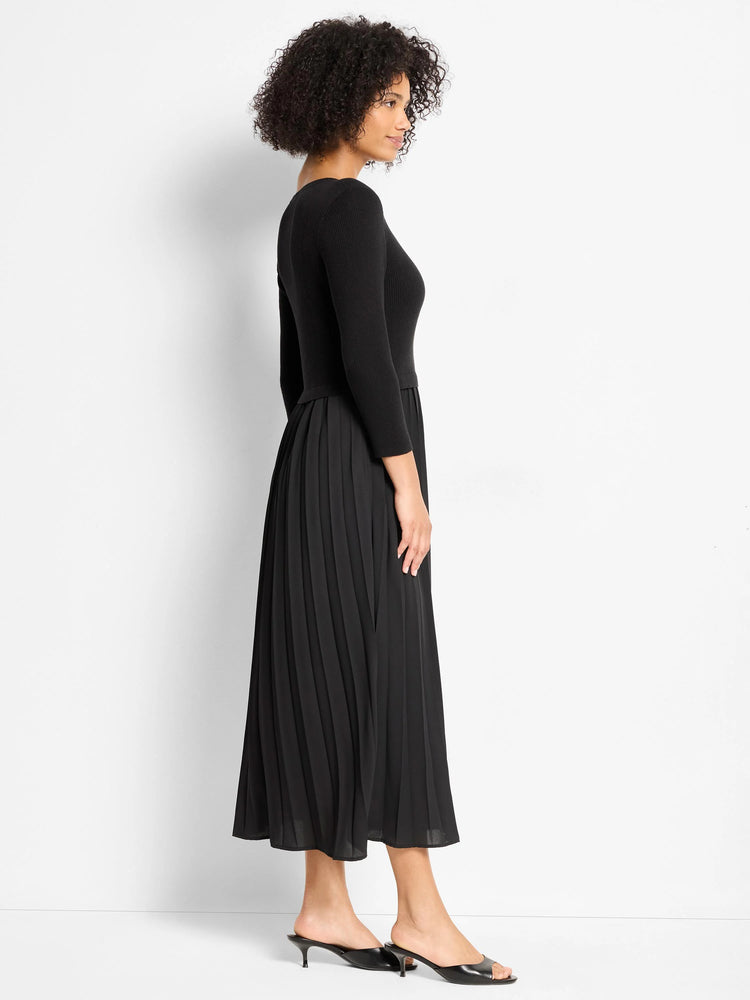 Black dress with a ribbed knit bodice and a pleated midi skirt.