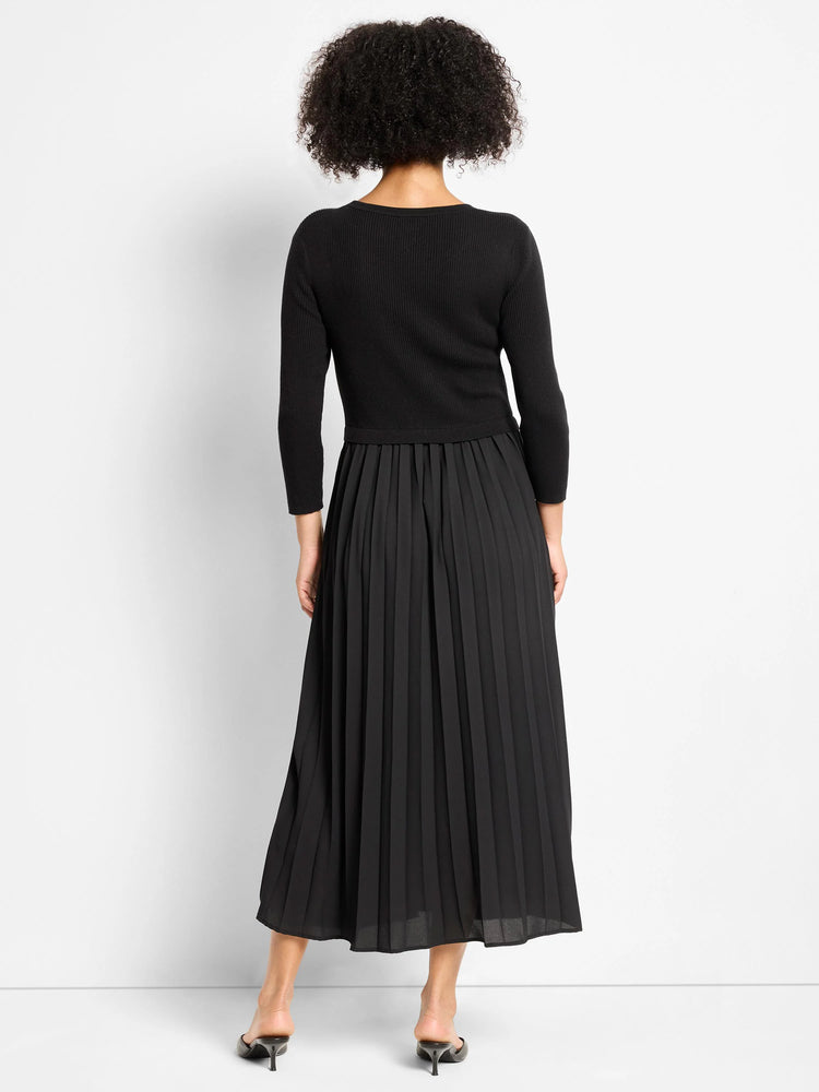 Black Kyrie dress with a ribbed long-sleeve top and a full, pleated maxi skirt.