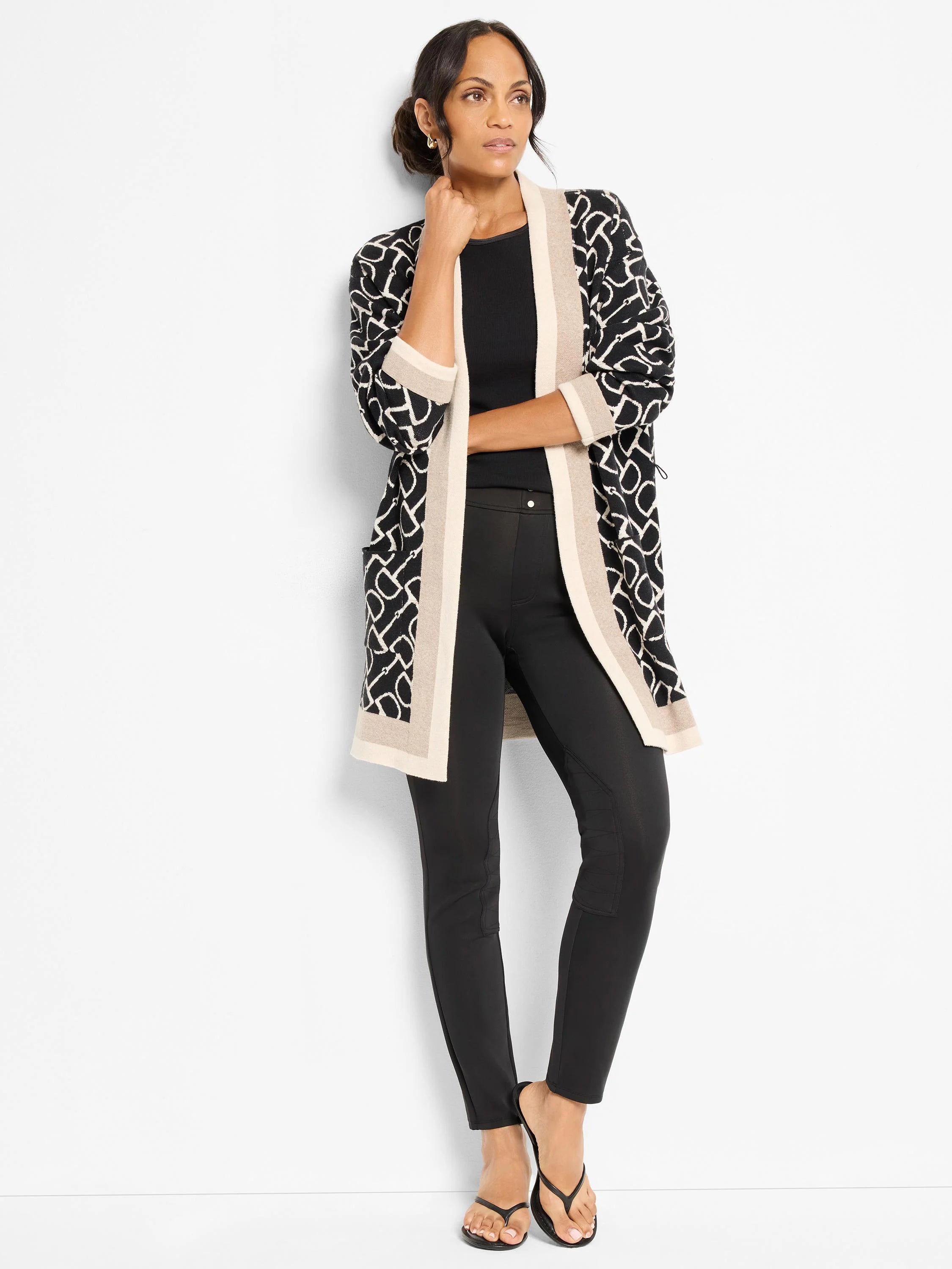 Black, fitted scuba riding pants with visible seaming at the knees and inner thighs.