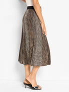 Knit midi skirt with ombre tan to black pixel pattern, A-line cut, black waistband.