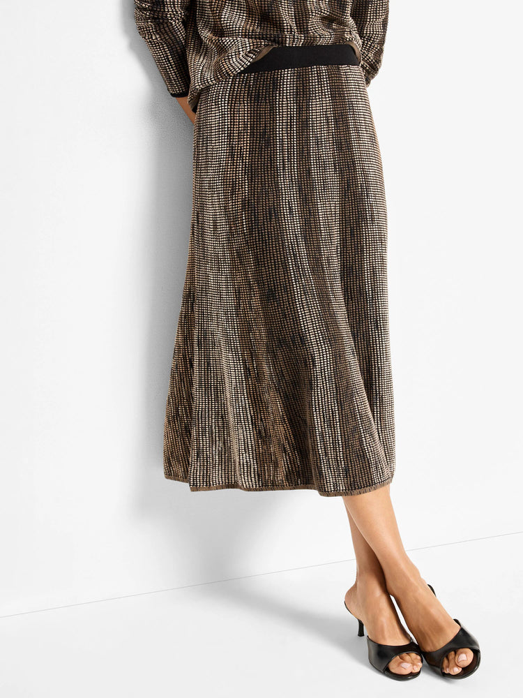 Tan and dark brown pixel knit midi skirt. Ombre from light at waist to dark at flared hem. Black elastic waist.