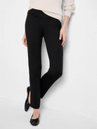 Black straight-leg ponte pants; slight waistband asymmetry.  Model wears neutral top & black flats.