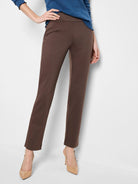Brown straight-leg pants on a model.  The pants have a mid-rise waist.