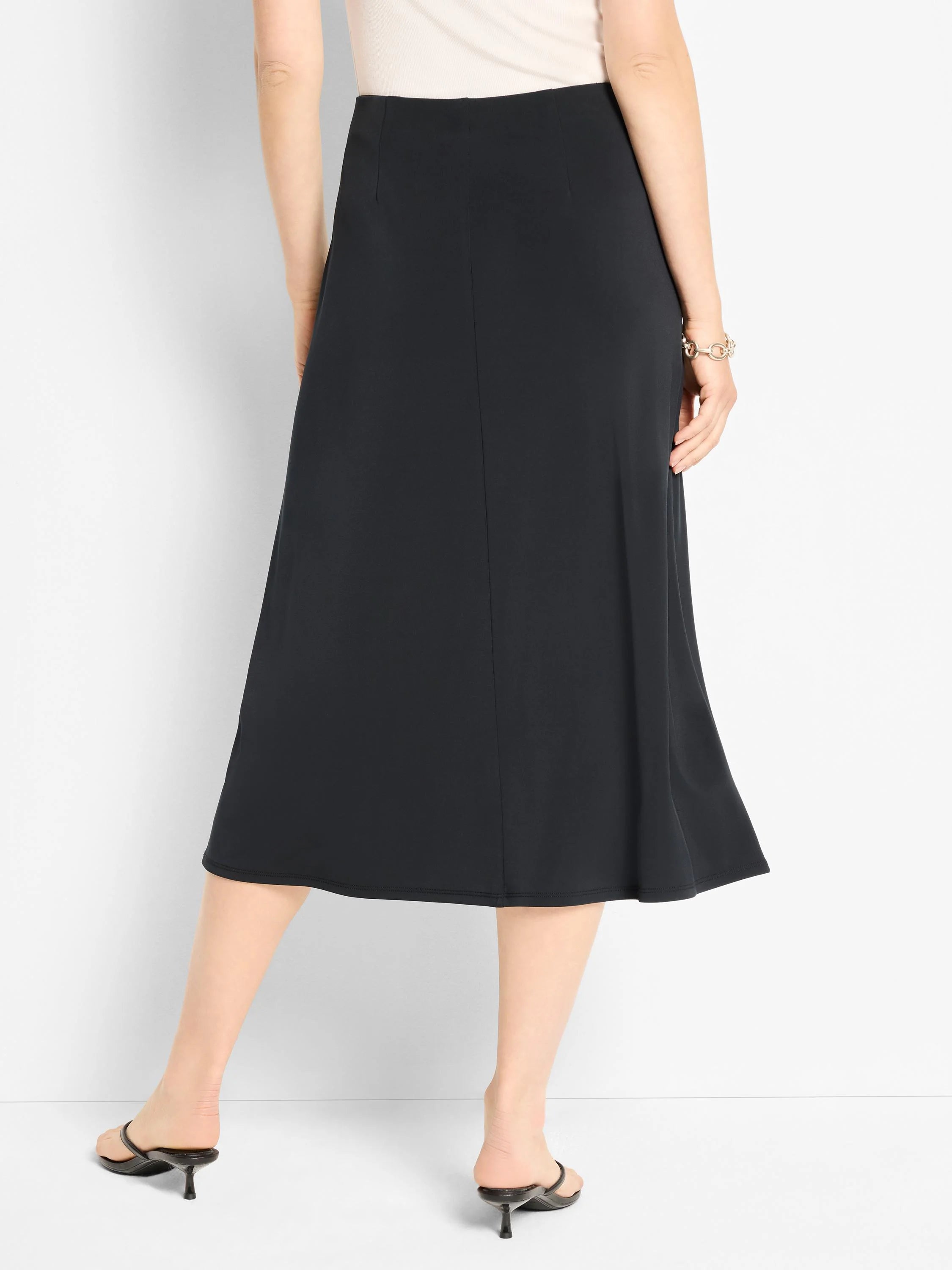 Black A-line midi skirt.  Straight back, subtle flare at hem.