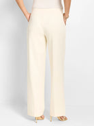 Cream wide-leg pants, full-length, with a smooth, sleek fabric.