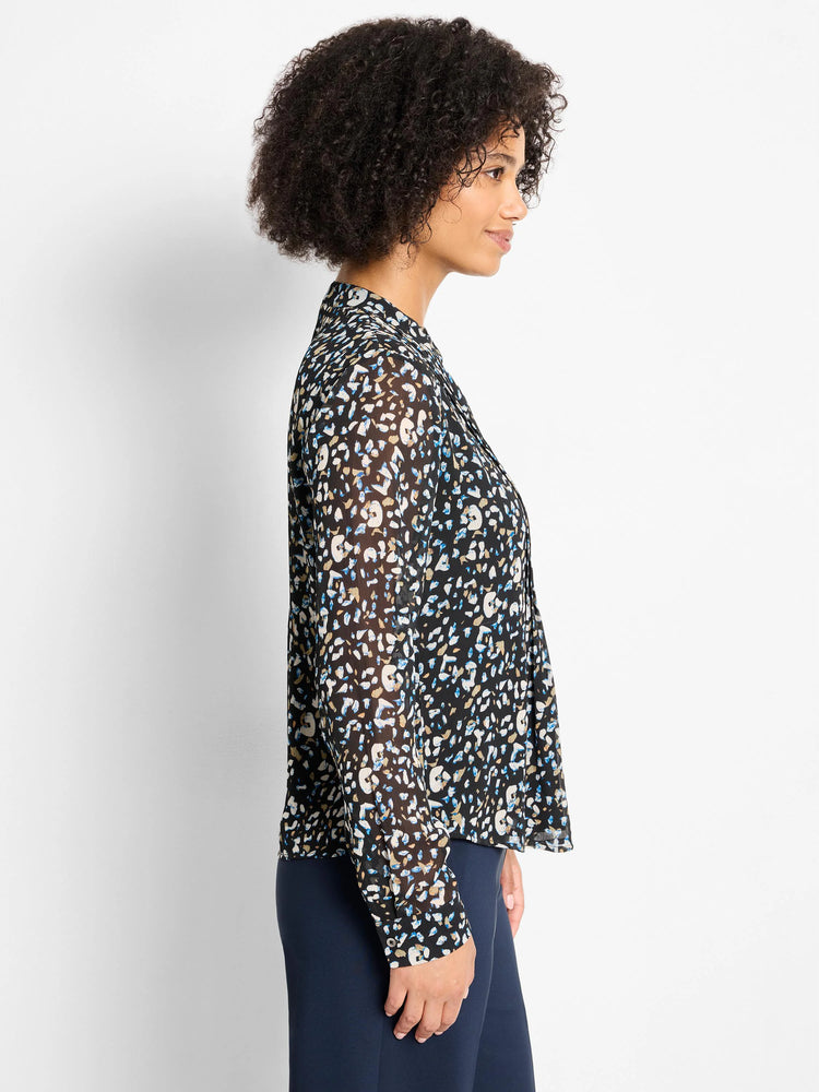 Sheer black long-sleeve top with abstract blue, tan, and cream cheetah spots. Features a band collar.