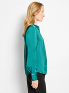 Teal glossy long-sleeved collared shirt with buttoned cuffs.
