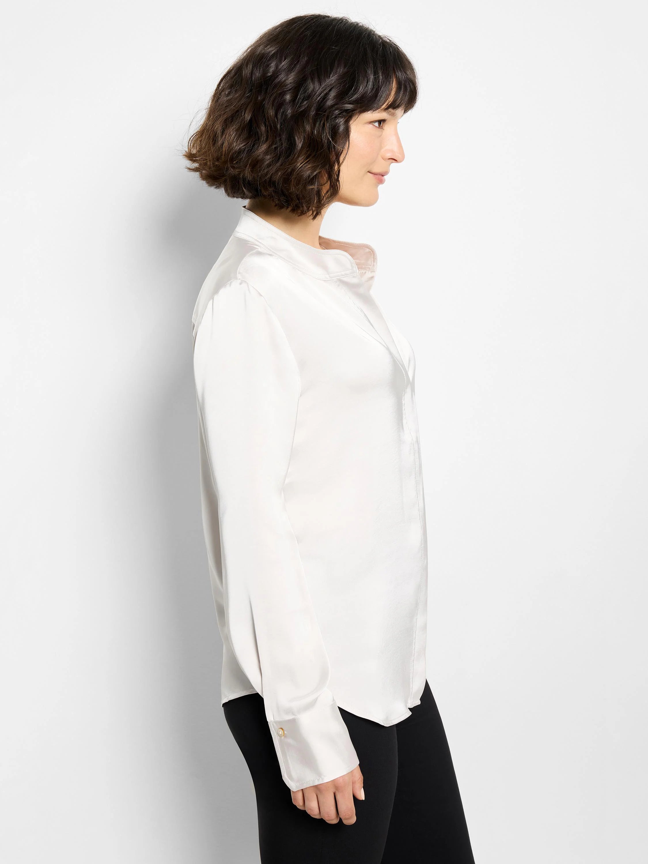 Off-white satin shirt; long sleeves, banded cuffs, Mandarin collar.  Subtle sheen.