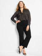 Black button-down shirt with thin, irregular white, brown, & tan vertical stripes. Collared, long sleeves, 2 chest pockets.