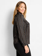 Black button-up shirt with thin, painted-look vertical stripes in white, tan, and brown. Long sleeves, collar.