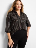 Black shirt, vertical white, tan, brown painted stripes. Button-down front, 2 chest pockets, 3/4 sleeves.