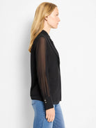 Black long-sleeve chiffon top with sheer sleeves, buttoned cuffs, and a softly draped front neckline.