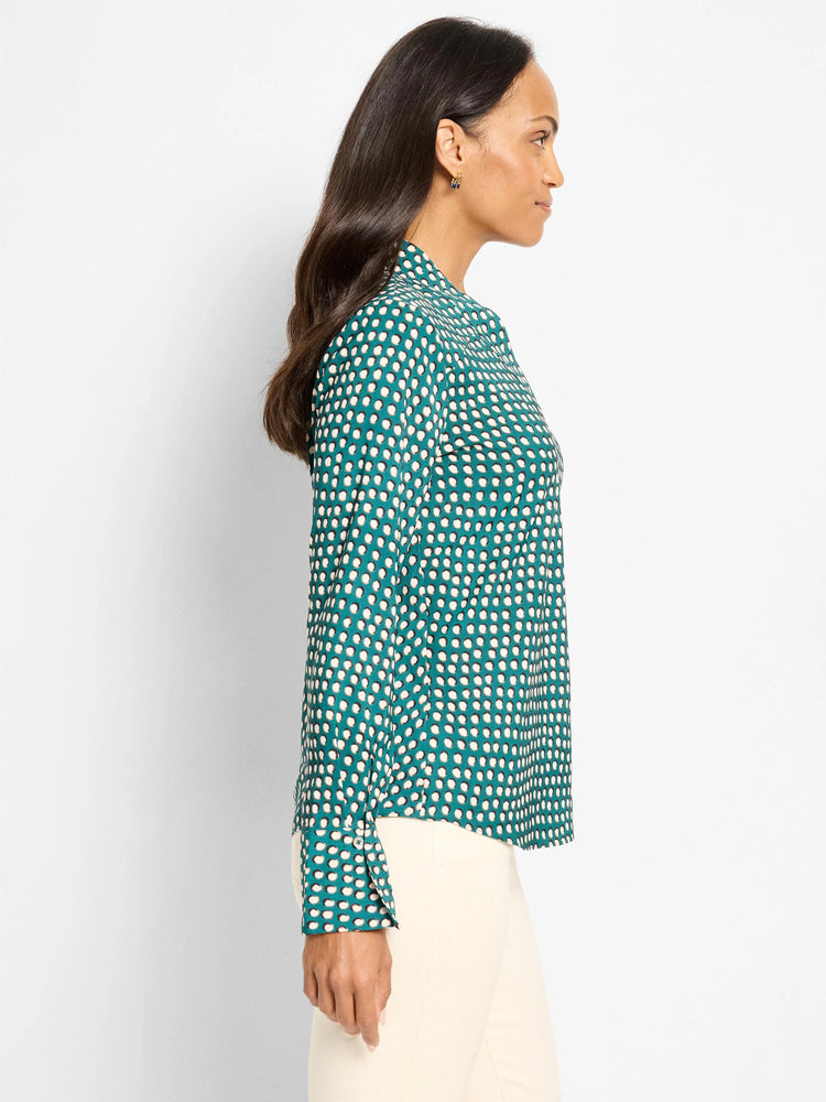 Teal long-sleeved top with light beige shadow dots and a band collar.