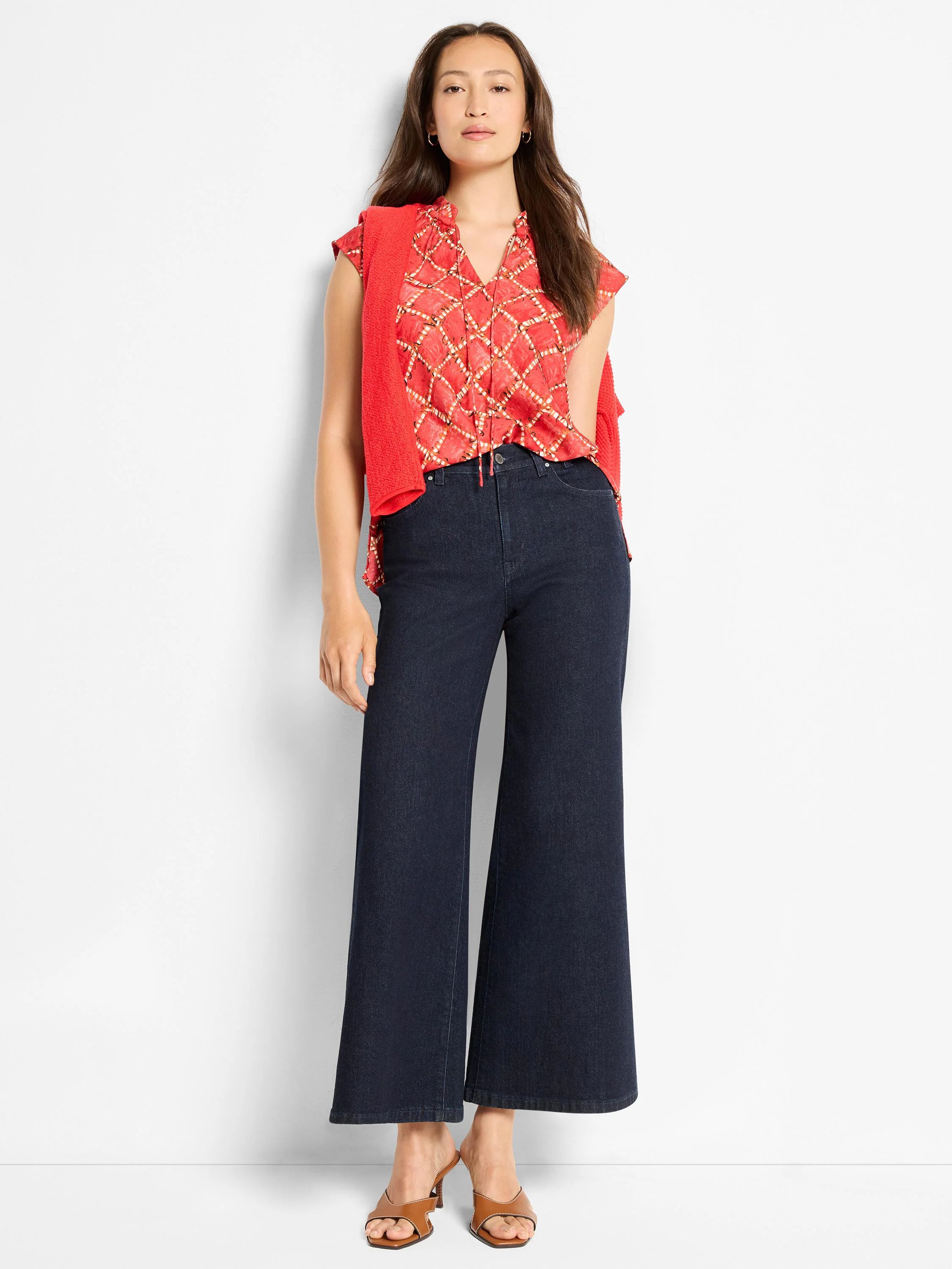 Red cap sleeve top with ruffled V-neck and light gold squiggle check pattern.