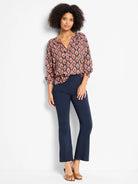 Harvest Ikat Top: Navy blouse with coral, orange, & blue geometric ikat pattern. Notch neck, 3/4 rolled sleeves.