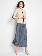 Mid-length slip skirt; navy blue background with tiny white & light blue pattern.