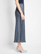 Midi slip skirt in navy blue with a light blue and white floral pattern.  A-line silhouette.