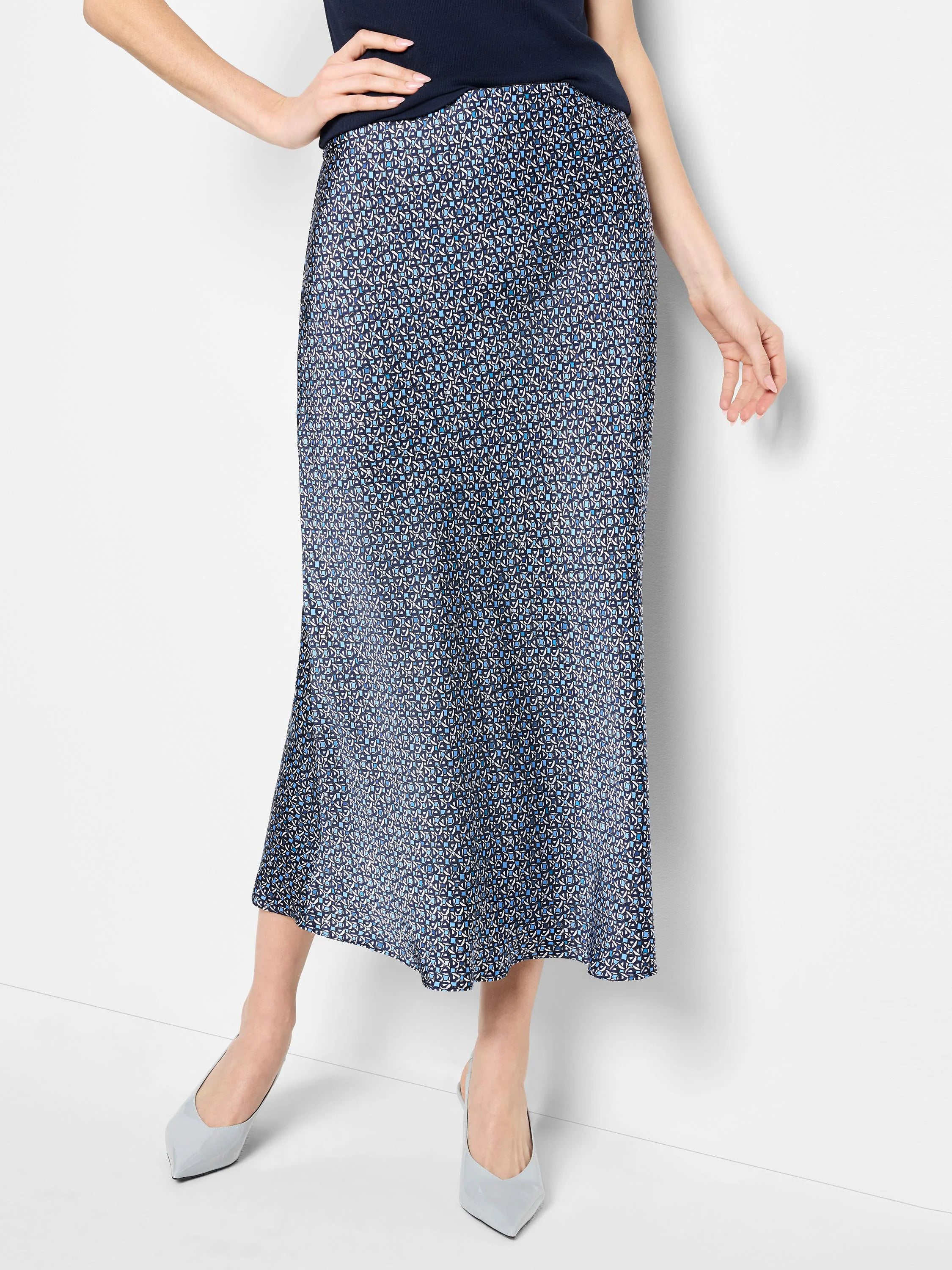 Mid-length slip skirt in navy blue with a light blue and white repeating geometric pattern.