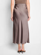 Here's alt text for the image, under 125 characters:

"Mauve-toned midi slip skirt, bias cut, shown from the back. ...