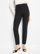 Black slim-leg pants; straight cut, high waist.  Model wears black heels.
